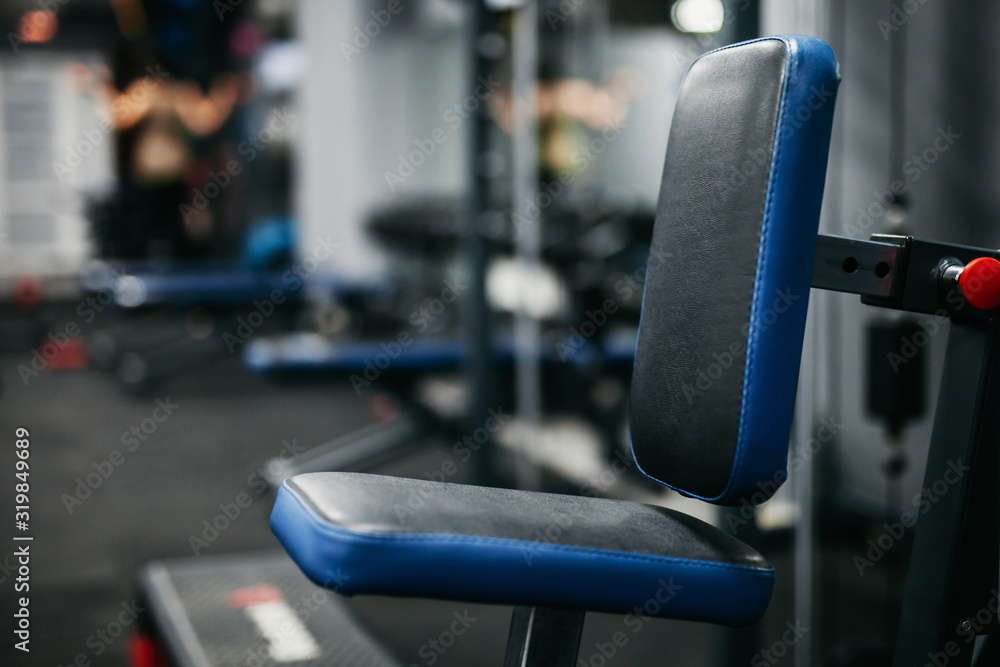 blue back gym machine with blurred background blue back gym machine with blurred background