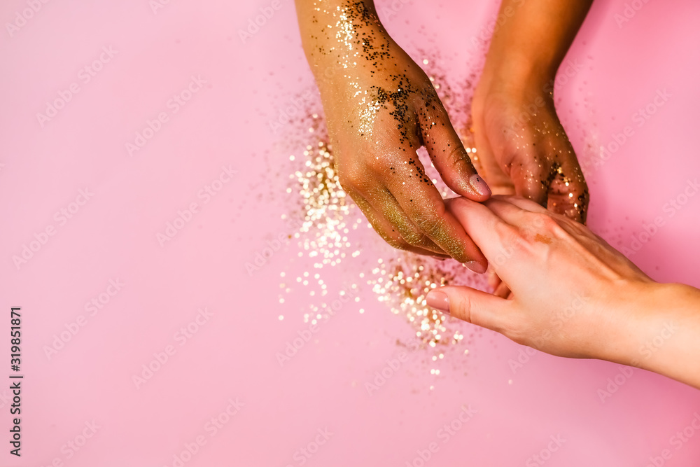 Fototapeta premium Hands and golden glitters.
