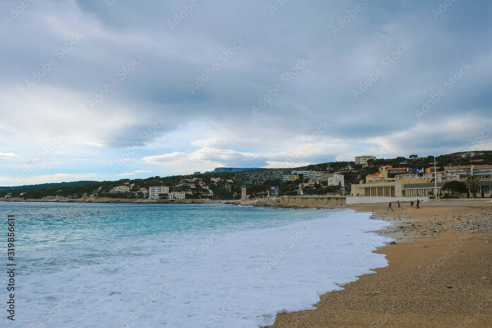 Mediterranean waves on the beach of the city of Cassis in France in the off-season. Copy space.