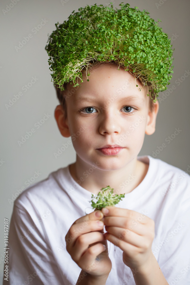 Kid with a microgreens hair. Healthy vegan foods concept. Cute little boy  holding some microgreens. Healthy eating, vegan, vegetarian, organic food  and drink. Environment protection Stock Photo | Adobe Stock