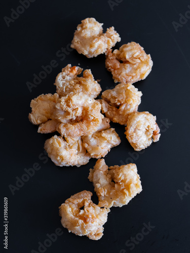 food, fried cheese breaded on a black background