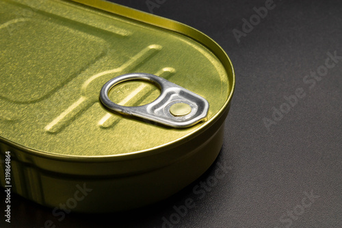 Closed sprats can on dark background