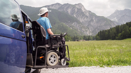 Disabled Man on Wheelchair using Accessible Vehicle with Lift or Ramp in Nature
