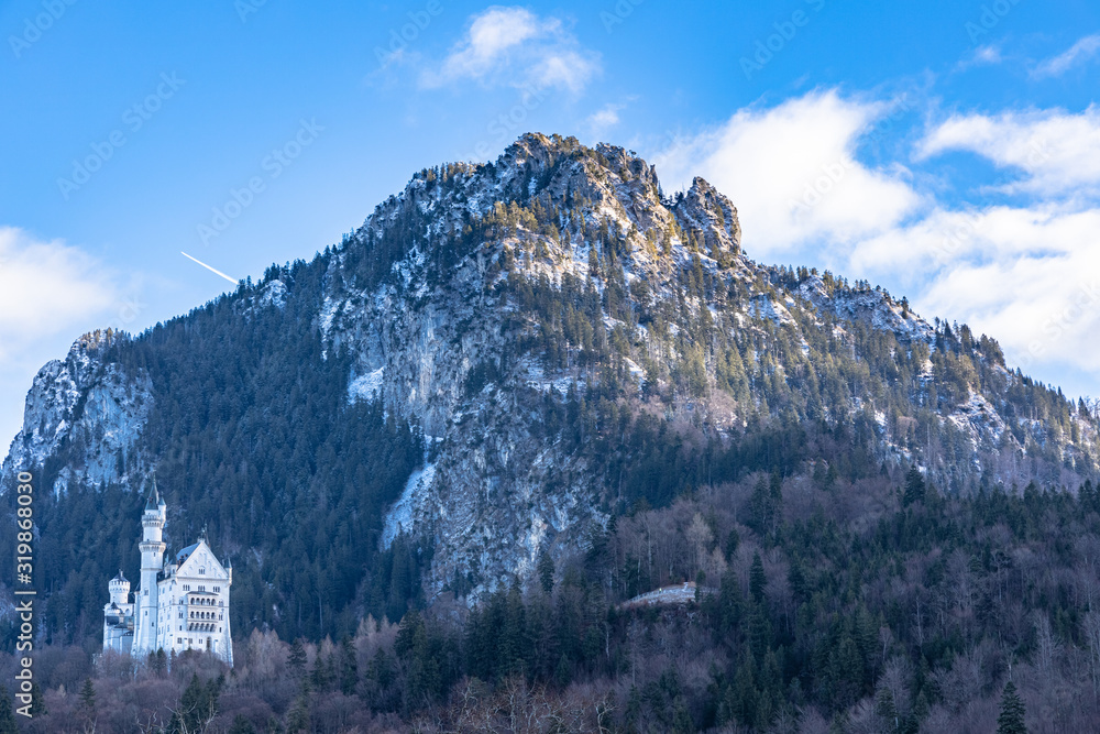 Beautiful view of the famous Neuschwanstein Castle located on the hill from the bottom of Schwangau in winter, Bavaria, Germany
