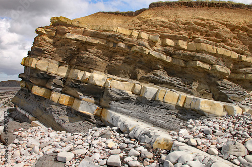 Kilve beach near East Quantoxhead in Somerset, England. The huge exposed layers of rock date back to the Jurassic era and are a paradise for fossil hunters photo