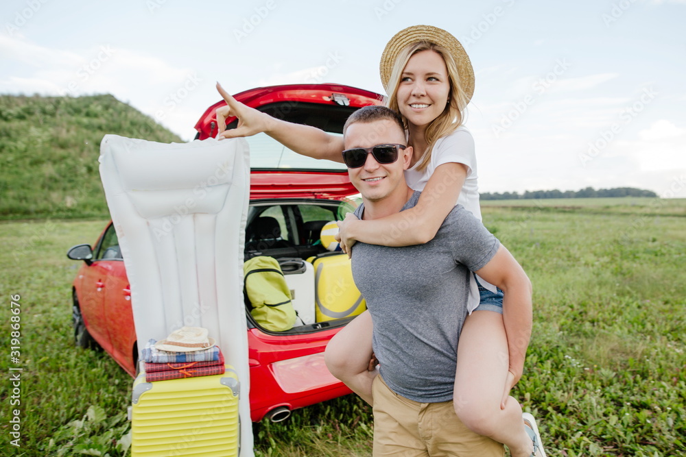 Fotografie Young couple having fun at a camping site