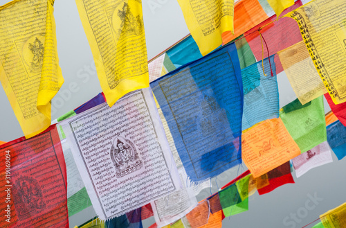 Colorful Tibetan prayer flags at Boudhanath (also called Boudha, Bouddhanath or Baudhanath) which is a buddhist stupa in Kathmandu, Nepal - UNESCO World Heritage Site photo