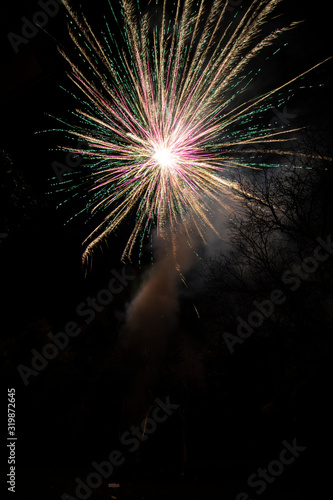 An amazing fireworks show during New Year's Eve celebration for the beginning of a happy new year on a nice Christmas in Spain, a colorful show in the night sky 