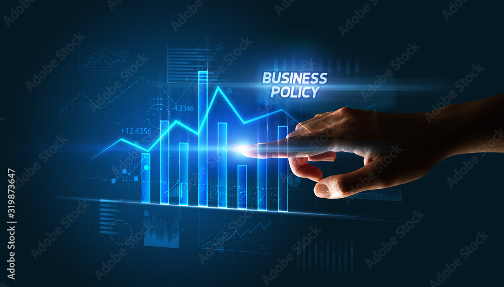 Hand touching BUSINESS POLICY button, business concept