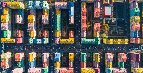 Urban landscape of colorful buildings. Aerial view of the colorful buildings in the European city in the morning sunlight. Cityscape with multicolored houses  cars on the street in Kiev  Ukraine.