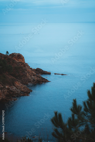 People fishing on the rocks in the Antlantic Ocean photo