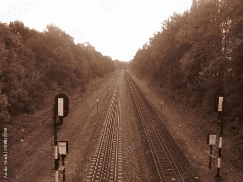 doppia ferrovia, vista da un cavalcavia in color seppia photo