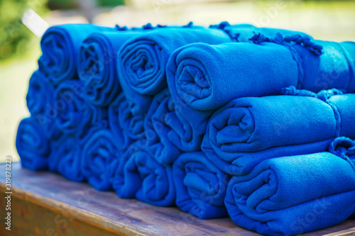 A set of warm blue rugs at an open-air party, in case guests feel cold in the evening photo