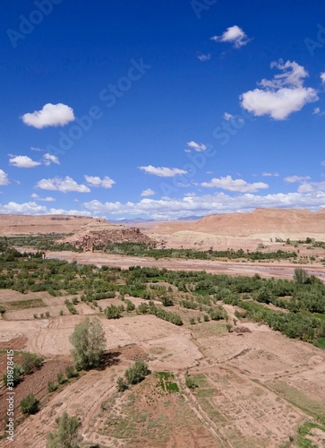 Casbah with green gorge, surrounded by desert, Morocco, Africa