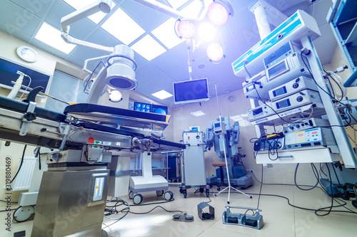 Fototapeta Naklejka Na Ścianę i Meble -  Modern operating room with advanced equipment, special medical devices, hospital room interior.