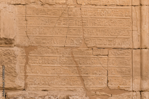 Karnak Temple, complex of Amun-Re. Embossed hieroglyphics on walls. Luxor Governorate, Egypt.