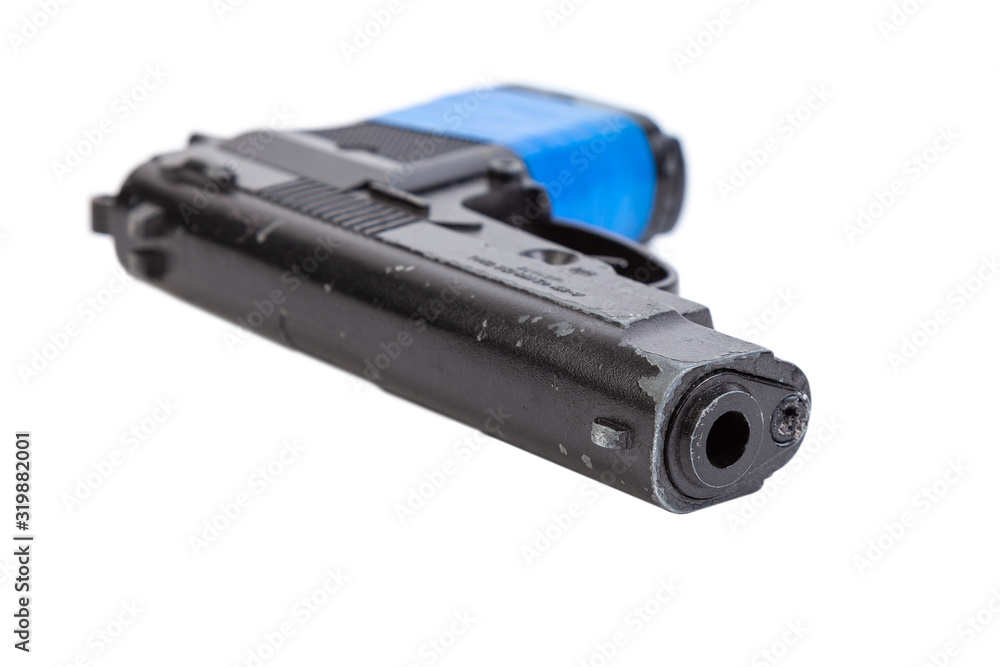 Black metal pistol with a handle wrapped in blue ribbon on a white isolated background Black metal pistol with a handle wrapped in blue ribbon on a white isolated background