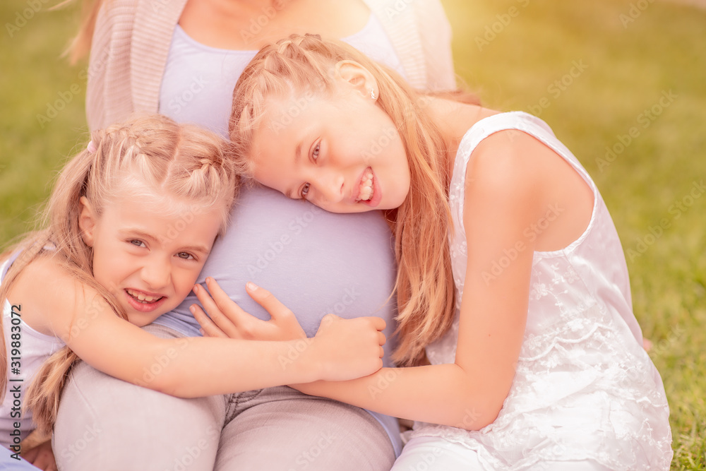mother and her kids are excited about the new baby mother and her kids are excited about the new baby