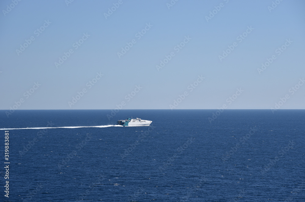 Fast ferry sailing through the sea near Gibraltar. 