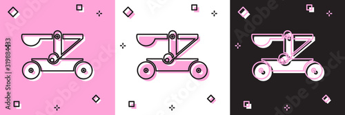Canvas Print Set Old medieval wooden catapult shooting stones icon isolated on pink and white, black background
