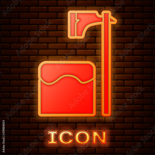 Glowing neon Executioner axe in tree block icon isolated on brick wall background. Hangman, torturer, executor, tormentor, butcher, headsman. Vector Illustration