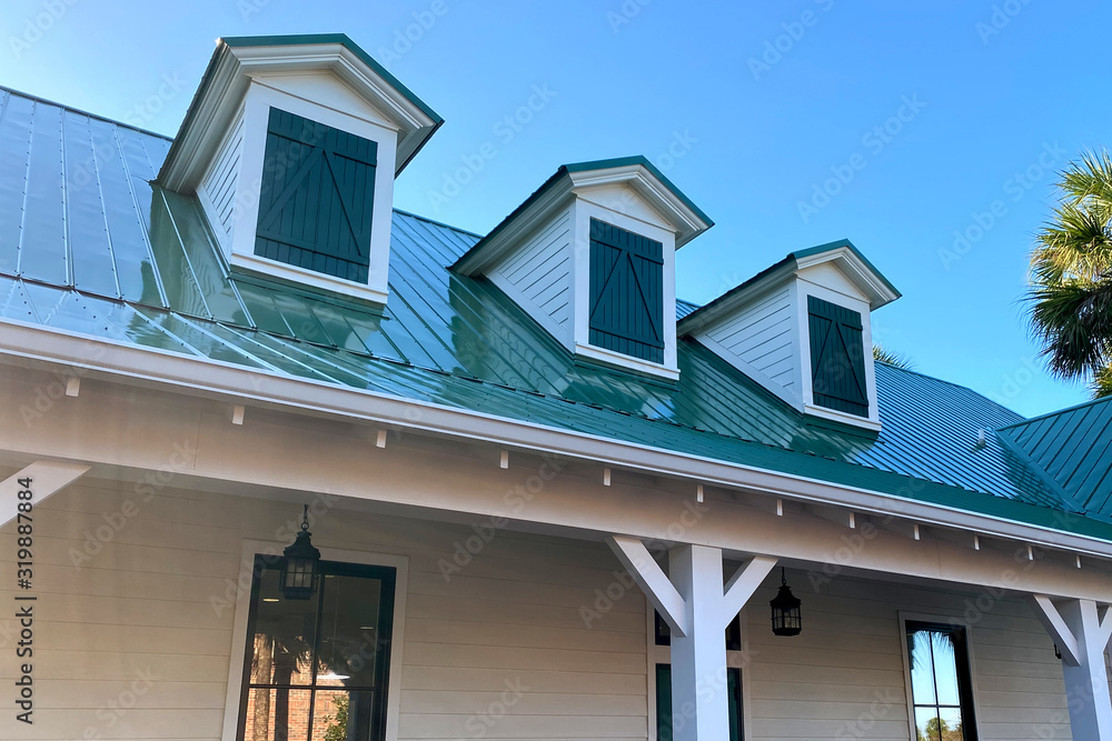 southern house roof line gables green shingles