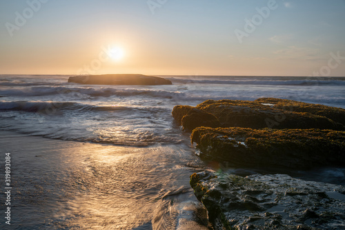 Tableau sur toile An amazing view of the sunset over the water in the Chilean coast
