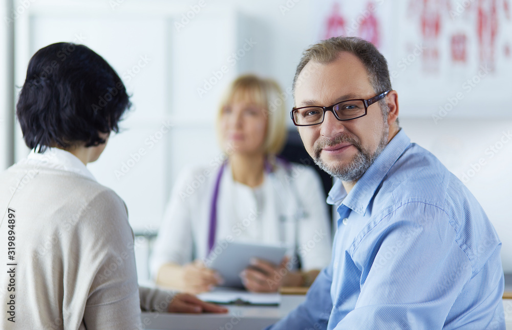 Smiling medical doctor and patient. Health care Smiling medical doctor and patient. Health care
