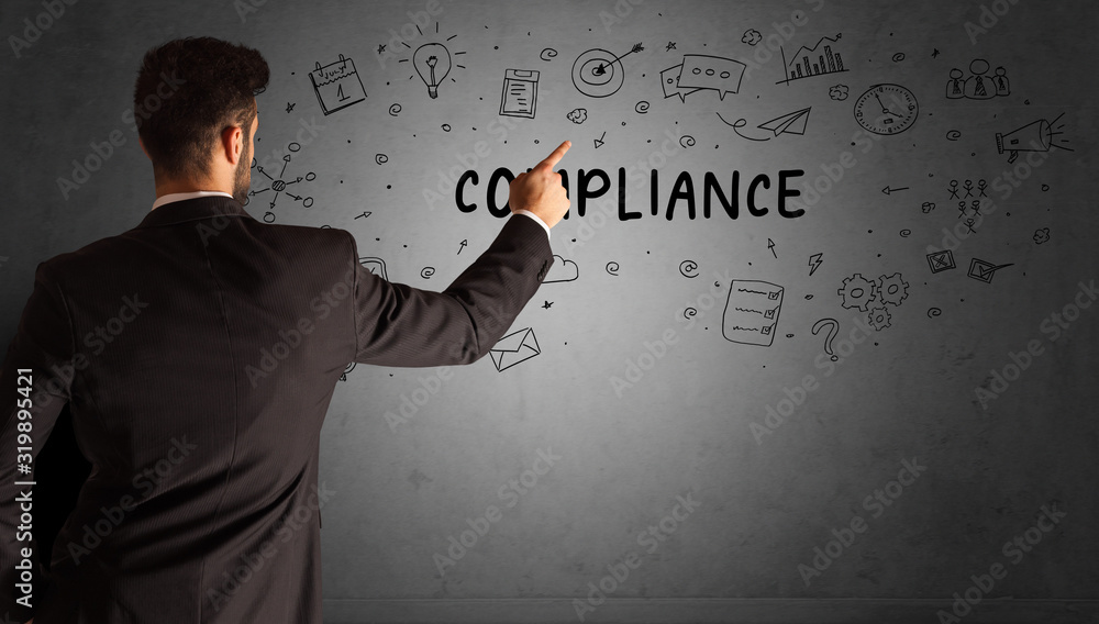 businessman drawing a creative idea sketch with COMPLIANCE inscription, business strategy concept businessman drawing a creative idea sketch with COMPLIANCE inscription, business strategy concept