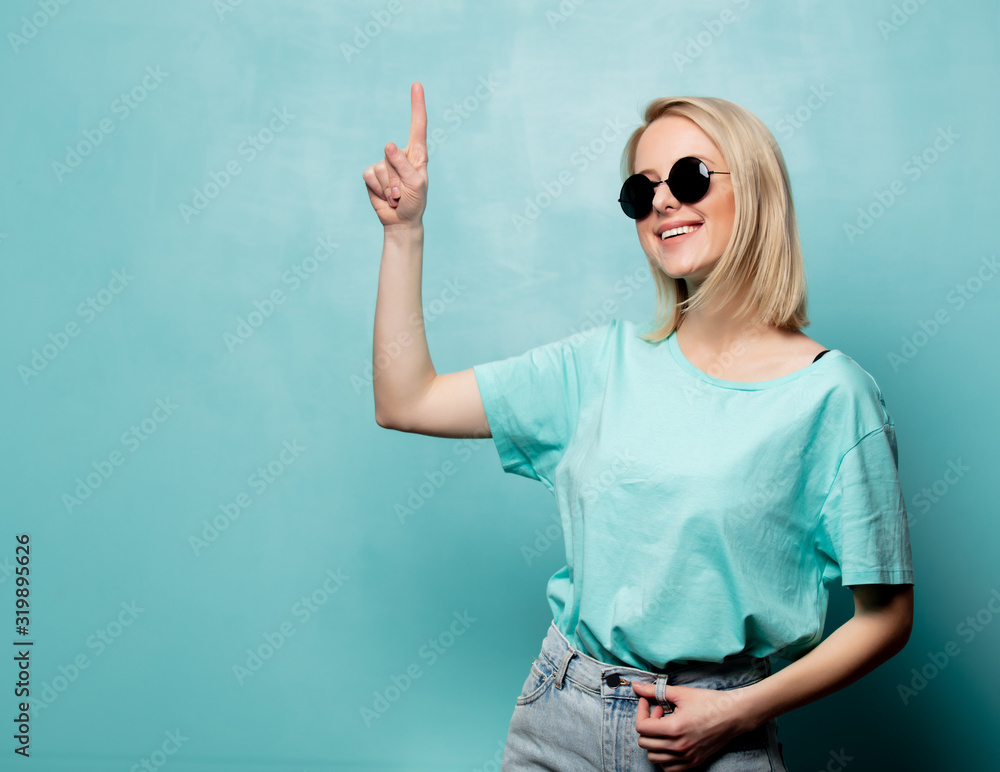 Beautiful blonde woman hold finger up Beautiful blonde woman hold finger up