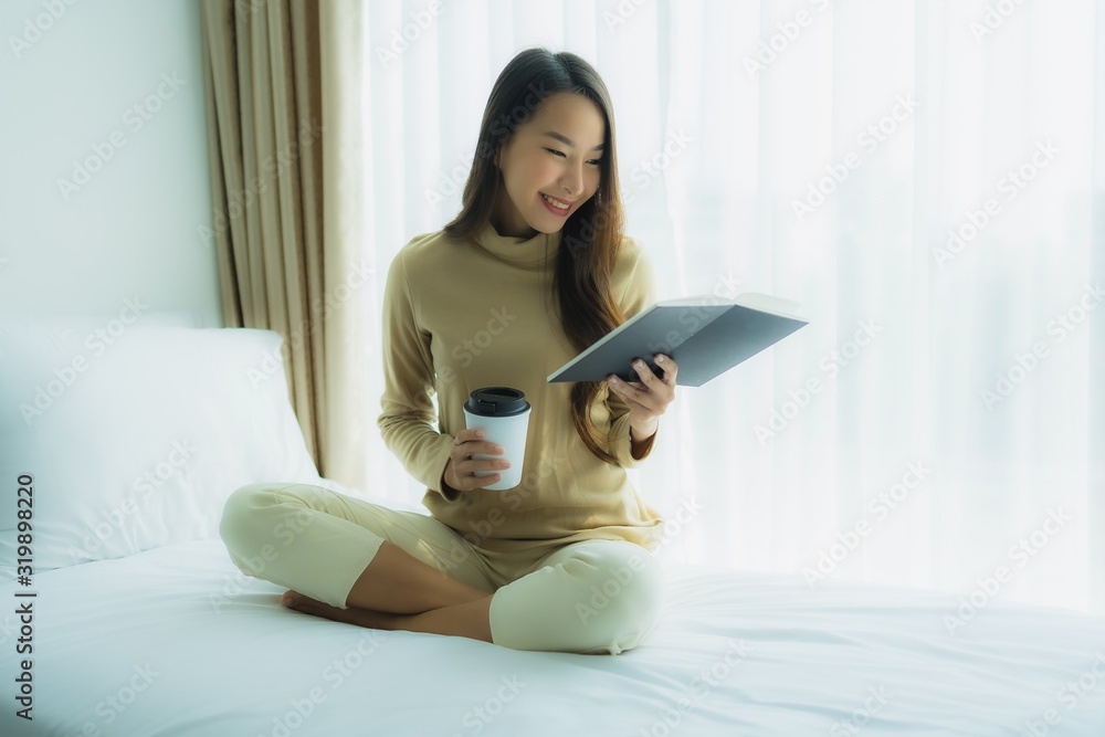 Young asian woman with coffee cup and read book Young asian woman with coffee cup and read book