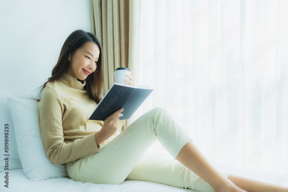 Young asian woman with coffee cup and read book Young asian woman with coffee cup and read book