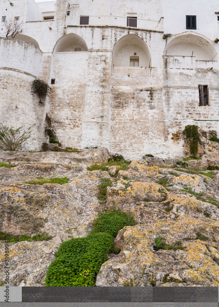 rocks and ancient castle in Puglia Italy