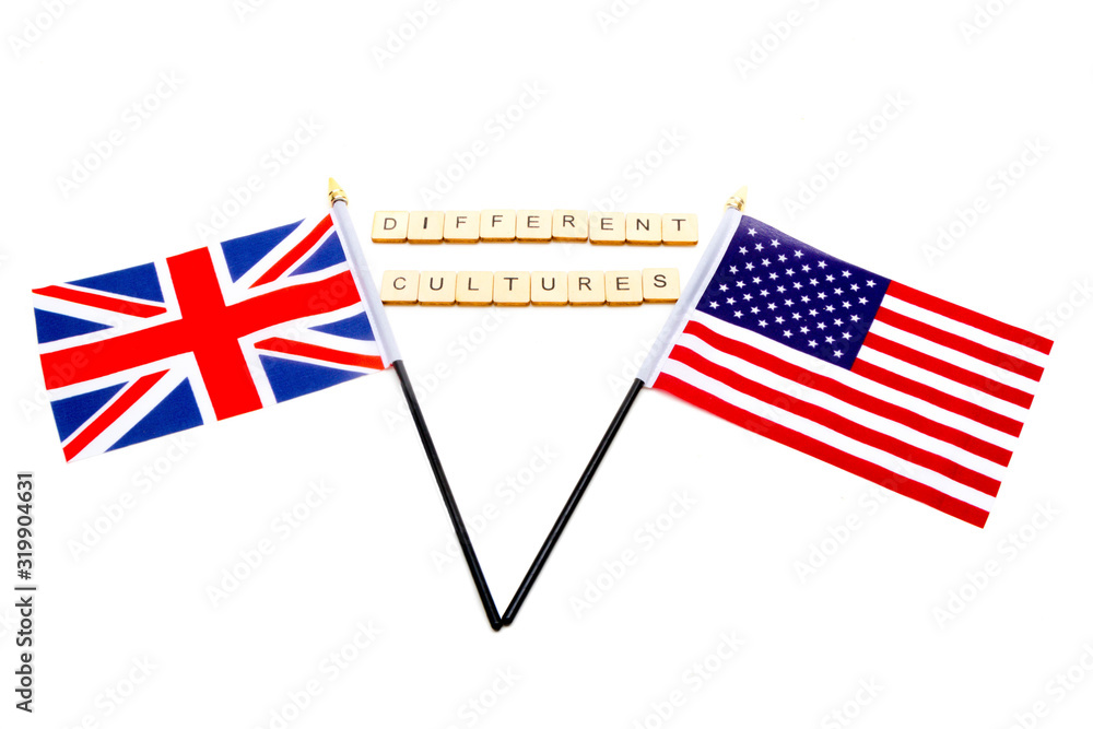 The flags of the United Kingdom and the United States isolated on a white background with a sign reading Different Cultures