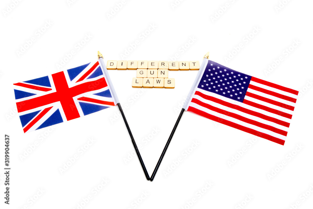 The flags of the United Kingdom and the United States isolated on a white background with a sign reading Different Gun Laws The flags of the United Kingdom and the United States isolated on a white background with a sign reading Different Gun Laws