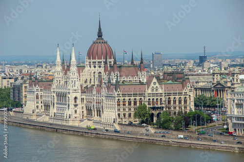 Hungarian Parliament (Országház) and other buildings of the city next to Danube river. Landscape view in the morning. Budapest, Hungary.