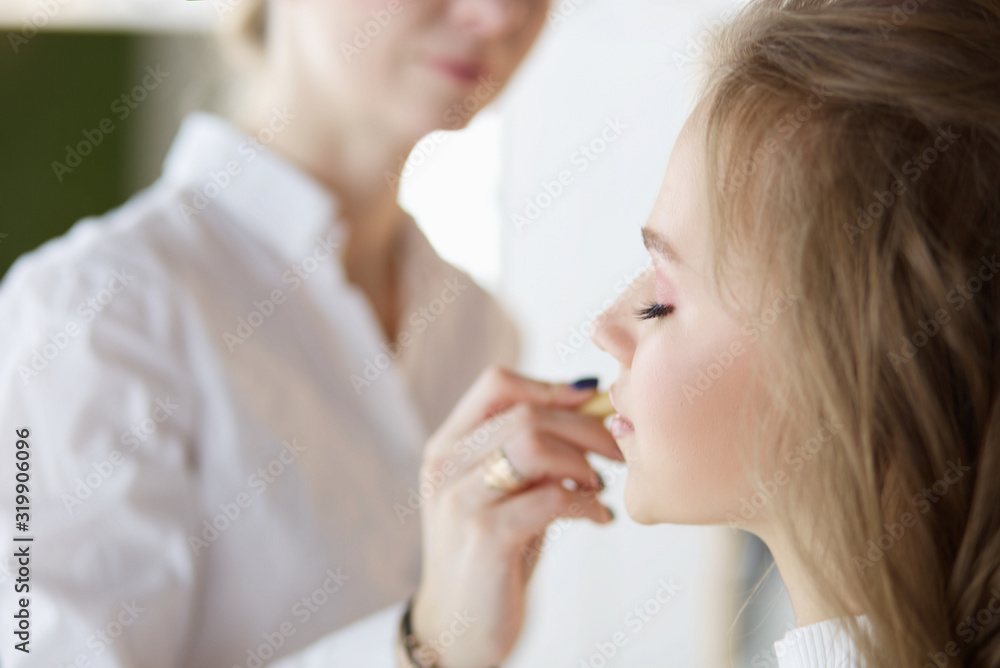 beautiful young model woman getting fashion make-up beautiful young model woman getting fashion make-up