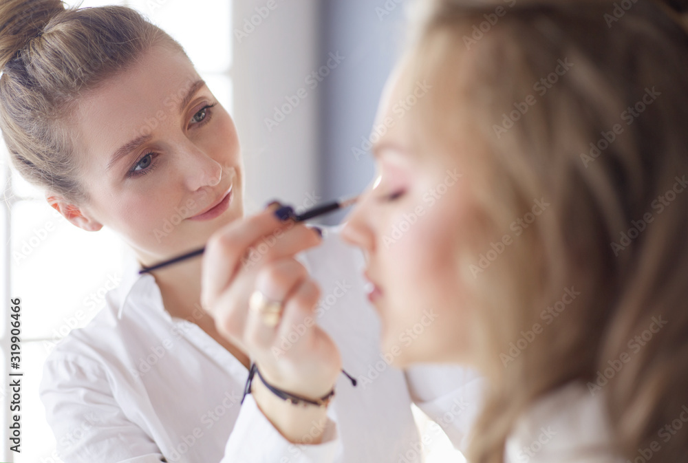 beautiful young model woman getting fashion make-up beautiful young model woman getting fashion make-up