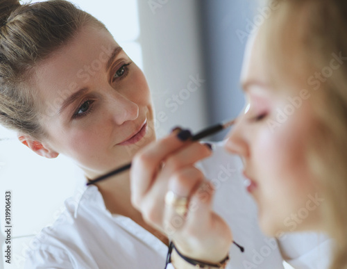 beautiful young model woman getting fashion make-up