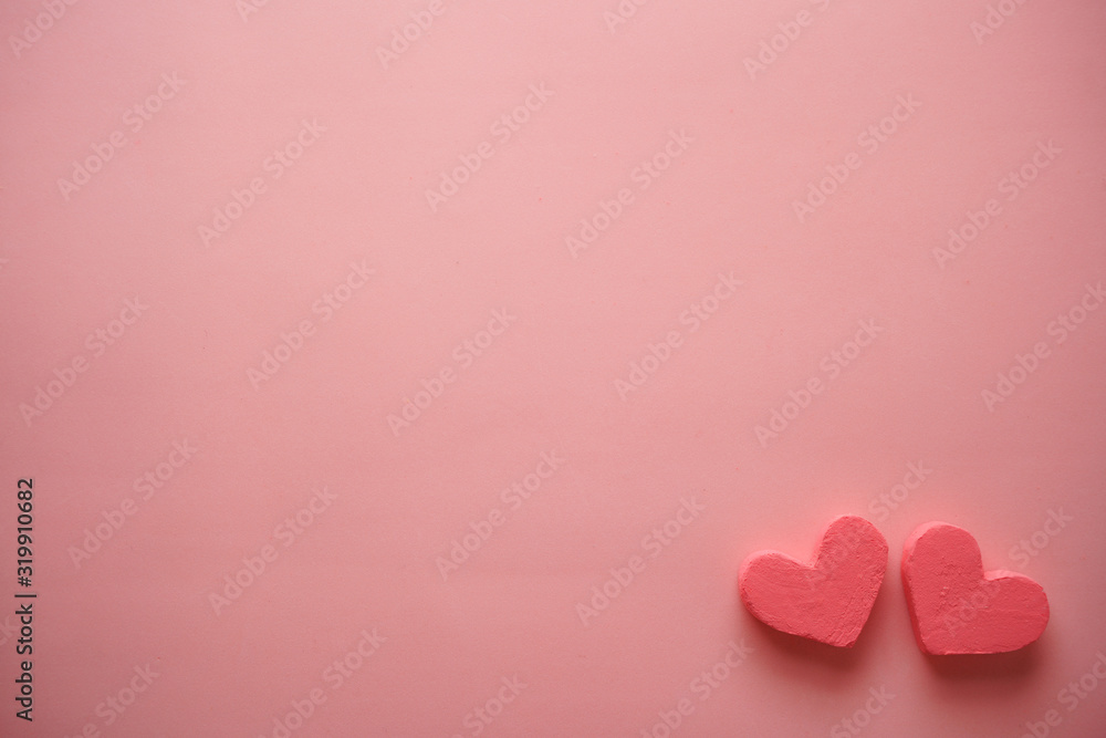 Pink background with two hearts. Copy space background