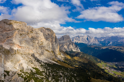 Aerial view of the Brunecker Turm, Langkofel Mountains and Passo Gardena Pass during sunset. Dolomites in South Tyrol photo