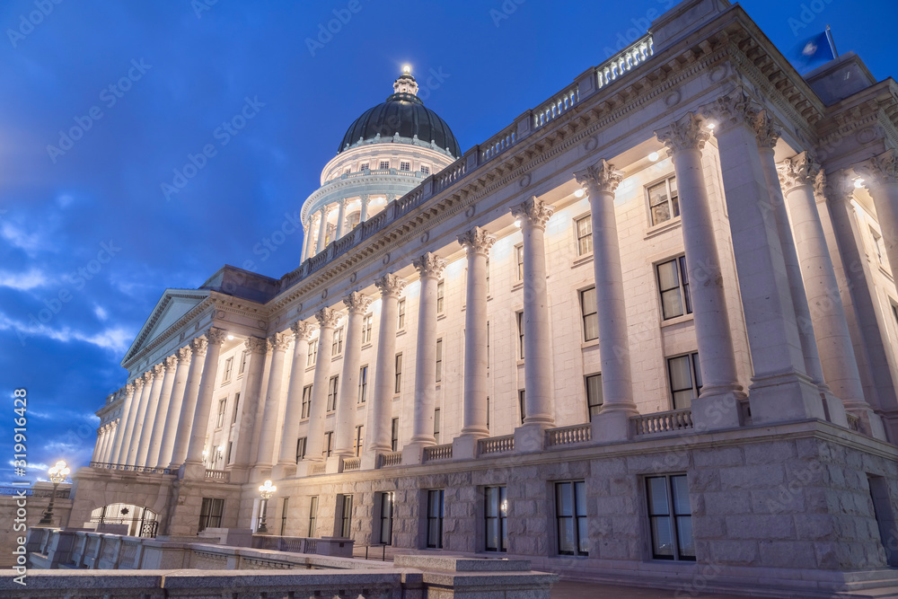 Facade of famous Utah State Capital Building glowing against vivid blue sky