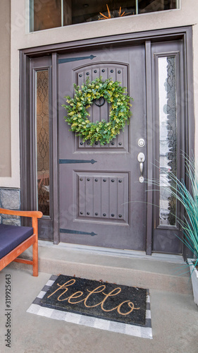 Vertical Beautiful home entrance with gray door sidelights and huge transom window