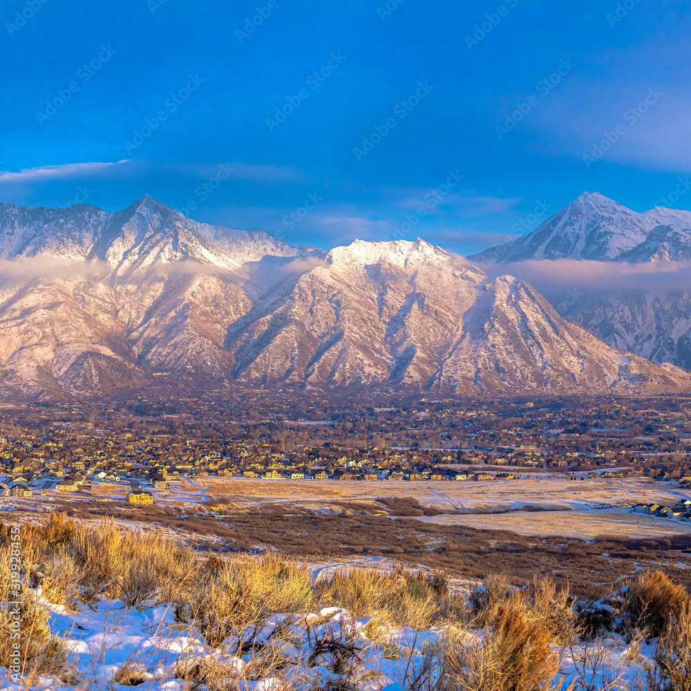 Square Panoramic view of Mount Timpanogos and residences blanketed with snow in winter Square Panoramic view of Mount Timpanogos and residences blanketed with snow in winter