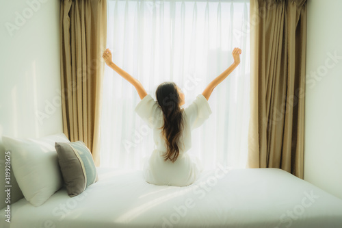 Wallpaper Mural Young asian woman happy smile relax on bed in bedroom Torontodigital.ca