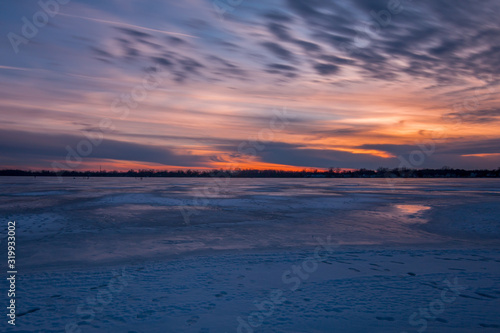 Sunset twilight on a frozen lake