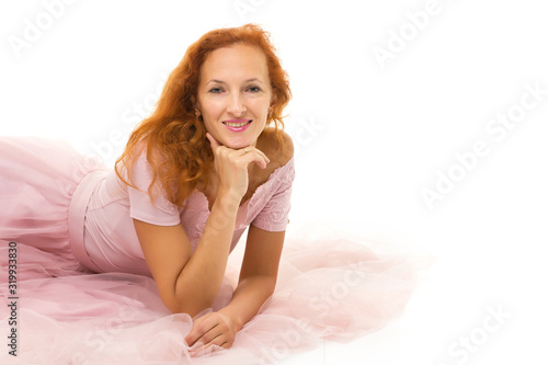 studio fashion portrait of beautiful young woman, sitting, on wh