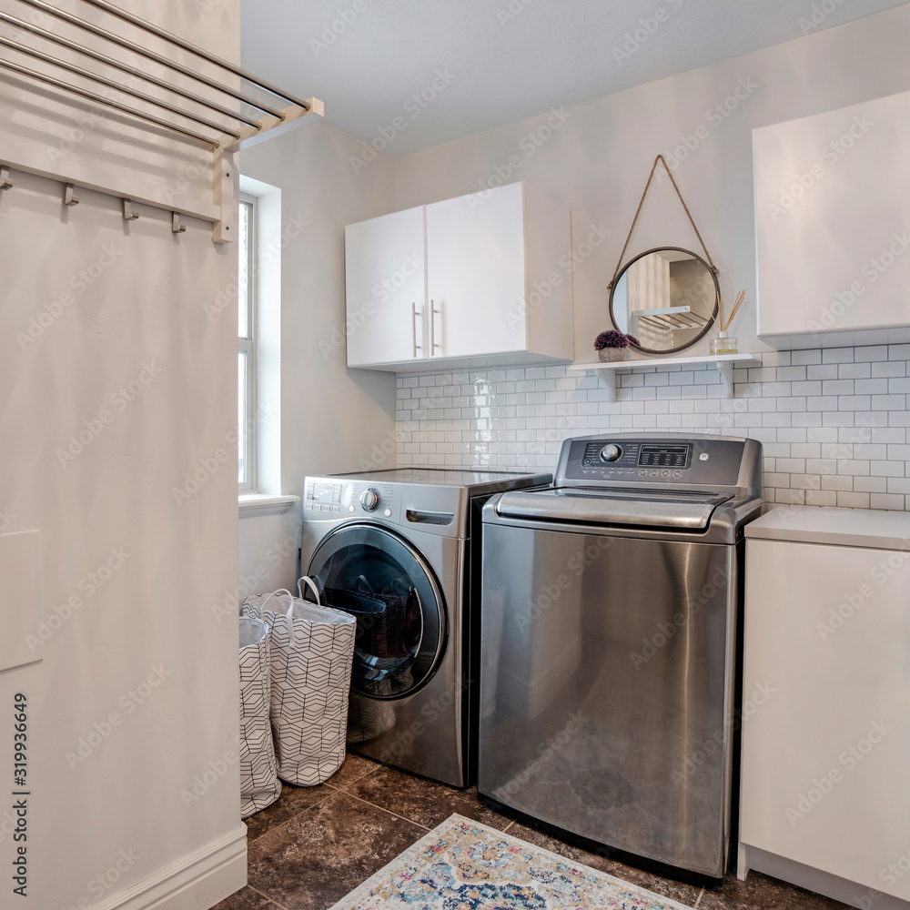 Square Laundry room interior with wahing machine and dryer