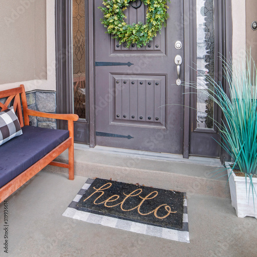 Square frame Beautiful home entrance with gray door sidelights and huge transom window