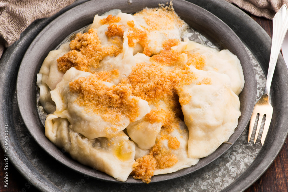 Boiled pierogi (Polish dumplings) stuffed with cabbage and mushrooms Boiled pierogi (Polish dumplings) stuffed with cabbage and mushrooms
